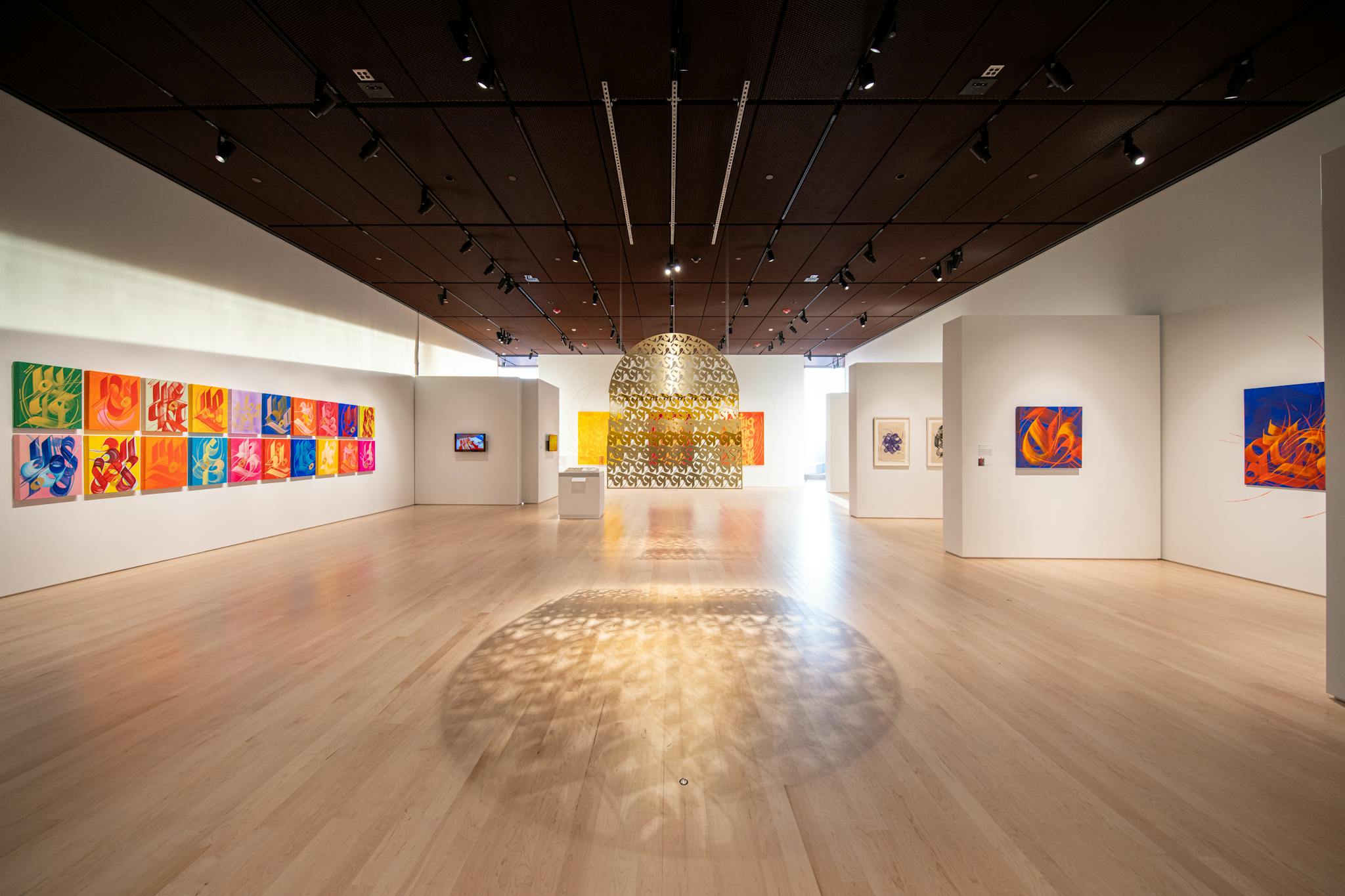 An expansive view of the Cantor Art Gallery with Sneha Shrestha's works on display.