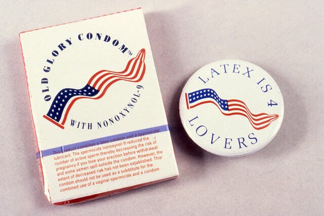A box of Old Glory condoms and a Latex is for Lovers campaign pin.
