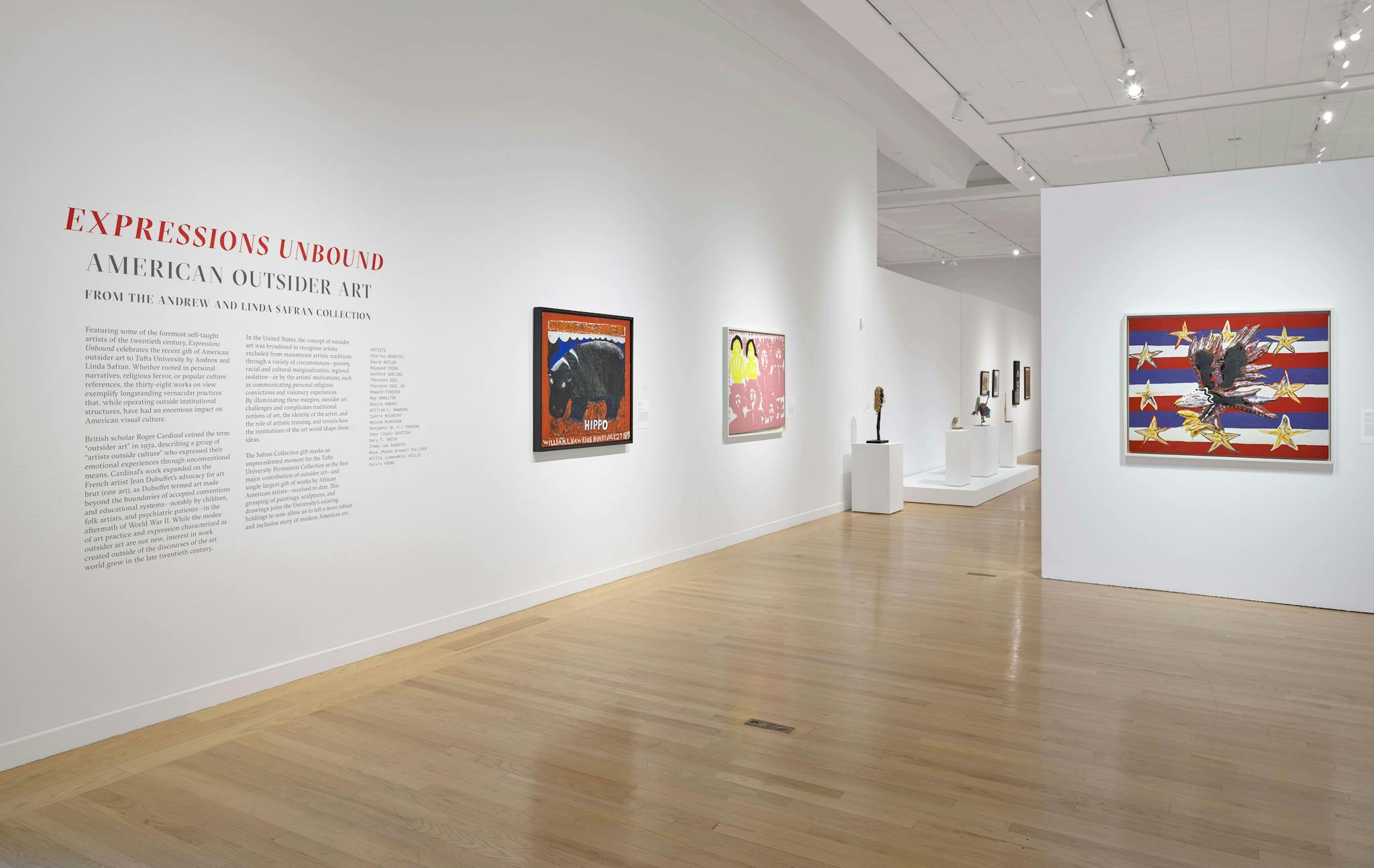 Works of American outsider art, such as one displaying the image of an eagle set against red, white, and blue stripes, appear on the walls of the gallery space.