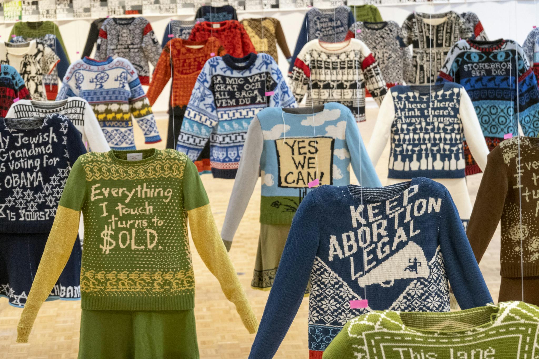 An array of sweaters bearing political and social messages.