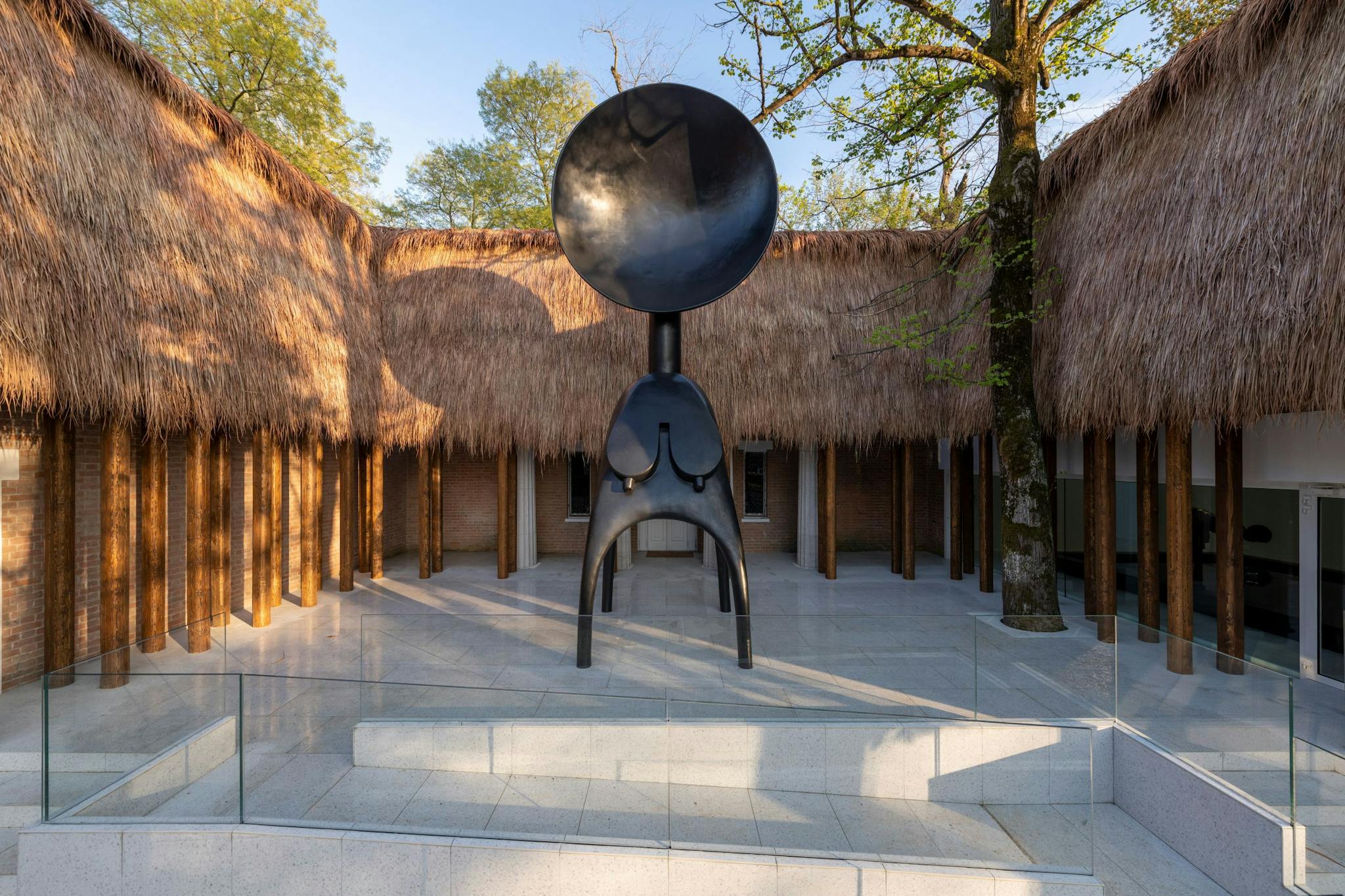 A work of art made from thatch, steel, and wood, designed by Simone Leigh.