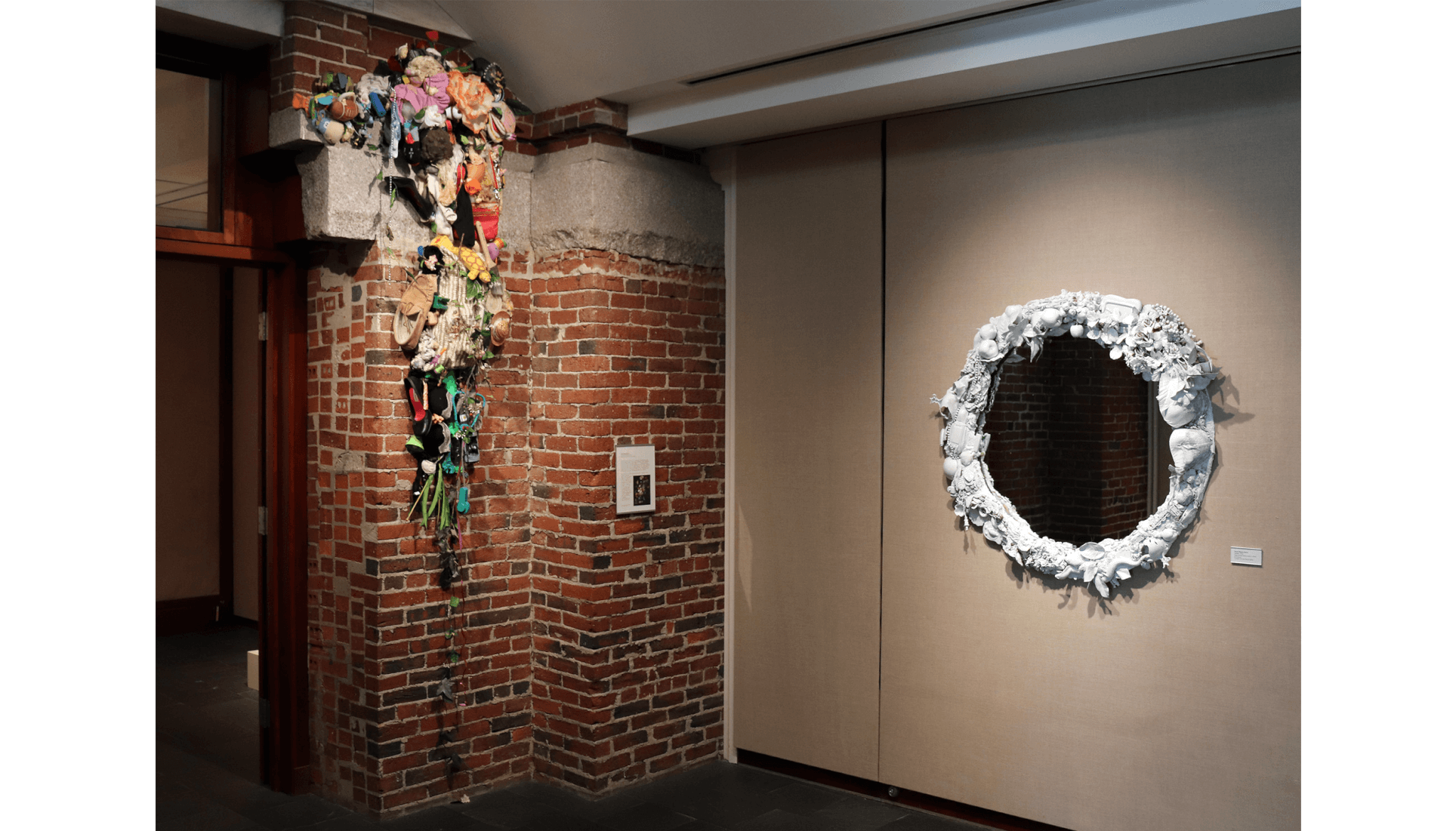 A white framed mirror and hanging sculpture is part of Sarah Meyers Brent's installation.