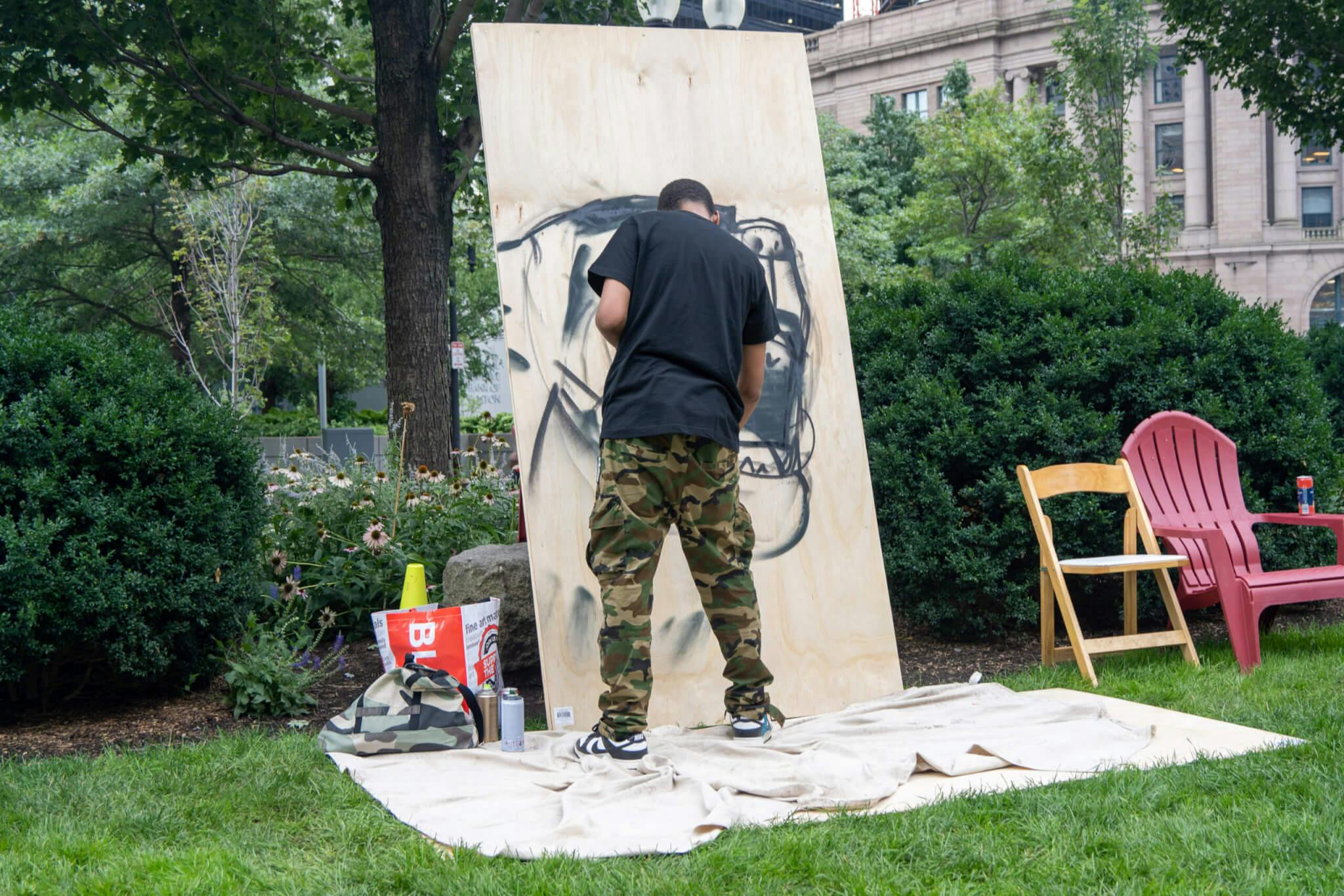 Image of Curtis Williams making live artwork at the “Sound in the City" event