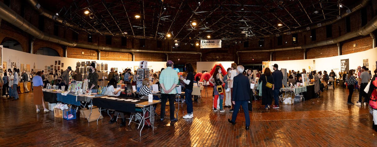 Exhibitors and visitors fill the Cyclorama at the Boston Art Book Fair.