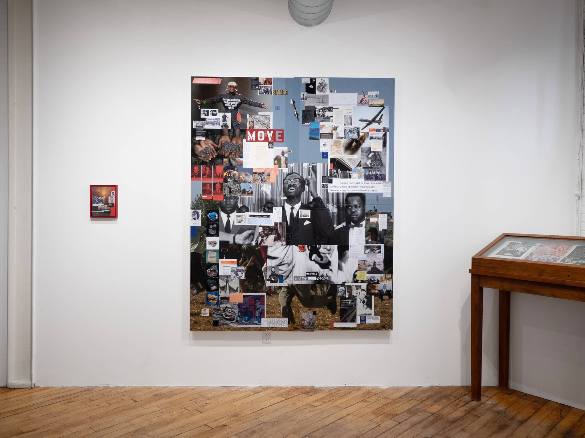 Collaged mixed-media works on a gallery wall.