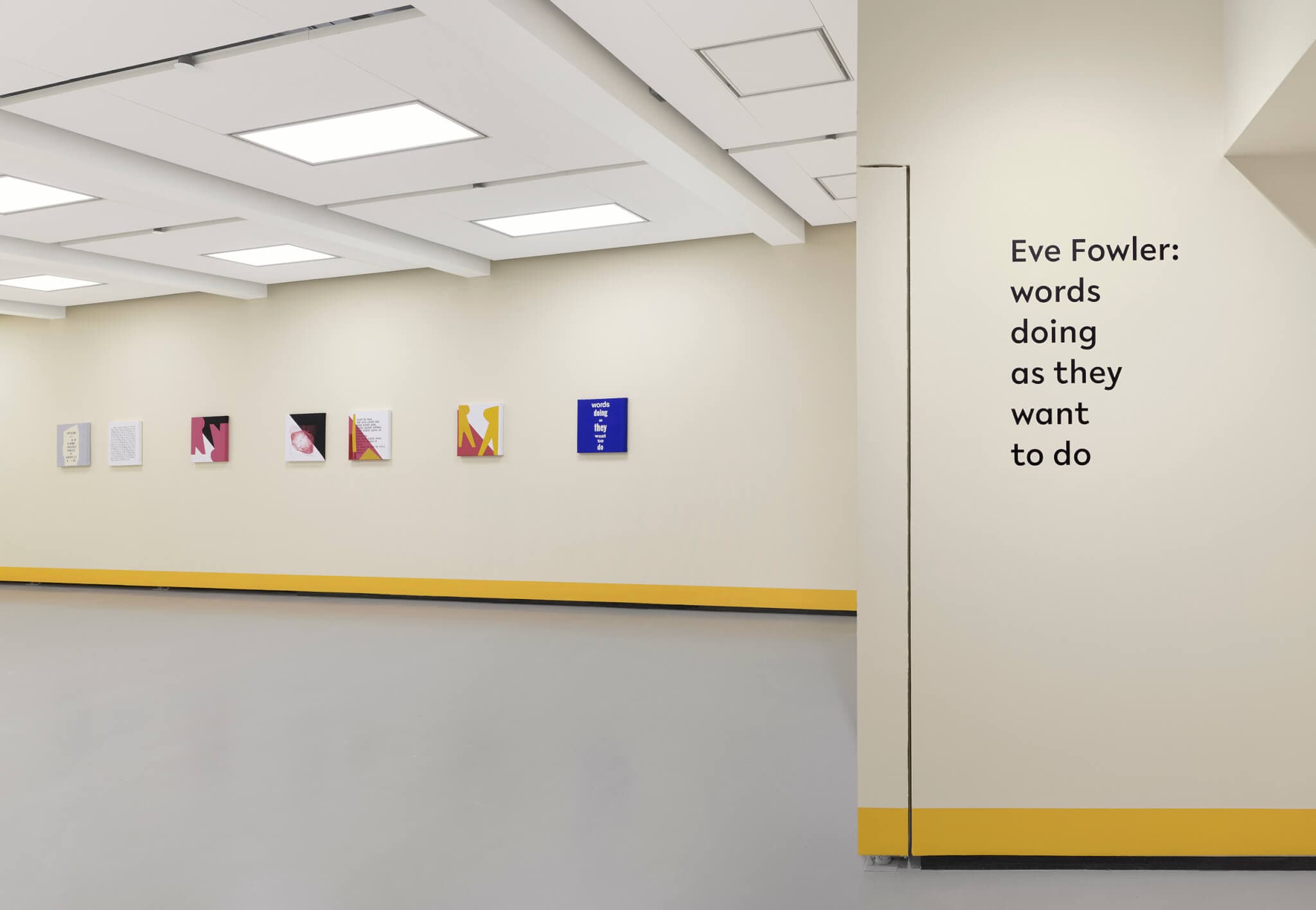 Acrylic on canvas paintings line a gallery wall.